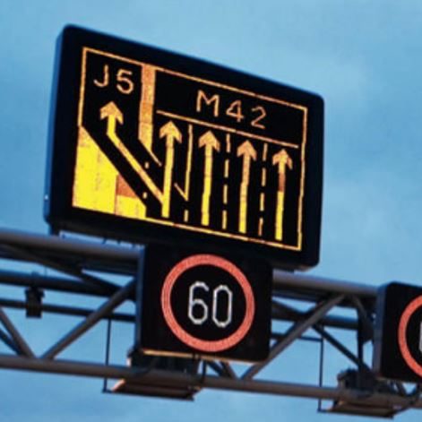 Tiled assembly makes large illuminated sign over the motorway